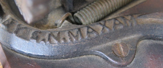 Close-up Image of Embossing Saying BY S.N. MAXAM